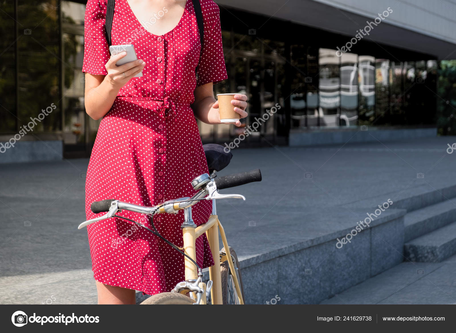 Woman Polka Dot Dress Bike Commuting Checking Mail Online Having Stock Photo by ©Photoboyko 241629738