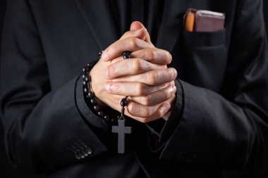 Christian person praying, low key image clipart