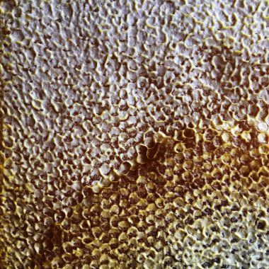 Soyut altıgen yapısı altın bal dolu arı kovanından bal peteği. Bal peteği yaz kompozisyonu arı köyünden yapışkan bal içerir. Arıların kırsal bal petekleri taşraya.