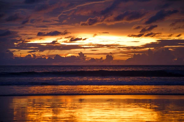 Magnificent sunset at seashore in orange colours