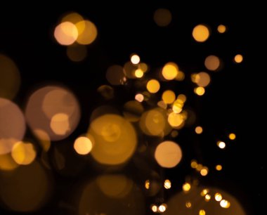 Led el feneri siyah bir zemin üzerine gelen bokeh