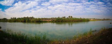 View to Euphrates river from former Saddam Hussein palace at Hillah, Babyl, Iraq clipart