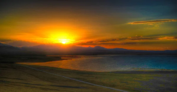 Panorama of Song Kul lake at the sunset, Kyrgyzstan