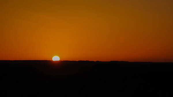 Sunrise at sandstone formation in the Sahara desert near Yoa Lake group of Ounianga Kebir in Ennedi, Chad