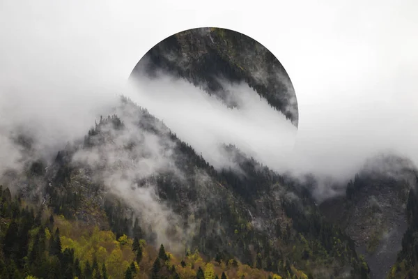 Geometric effect is a reflection of the landscape. Bright yellow trees in autumn. The slopes of the mountains are covered with a mixed forest. The tops are hiding in the clouds