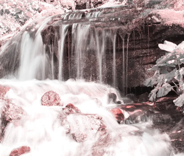 Waterfall on a mountain river. Retro toning. — Stock Photo, Image