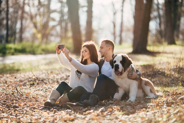 Young Couple Enjoying Nature Outdoors Together Adorable Saint Bernard Puppy — Stock Photo, Image