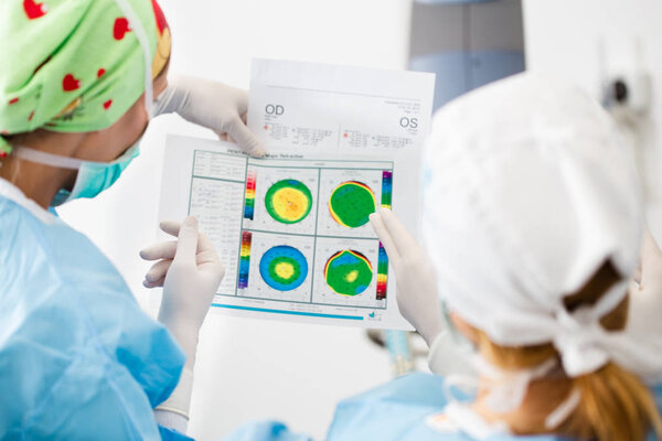 Eye surgery process, treatment of cataract and diopter correction. Surgical implementation of multifocal lens implants. Medical healthcare and technology theme.