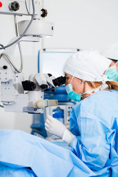 Eye surgery process, treatment of cataract and diopter correction. Surgical implementation of multifocal lens implants. Medical healthcare and technology theme.