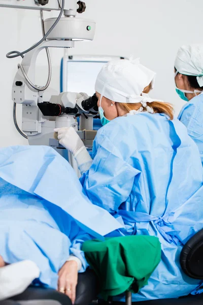 Eye surgery process, treatment of cataract and diopter correction. Surgical implementation of multifocal lens implants. Medical healthcare and technology theme.