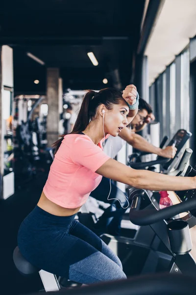 Young Attractive Woman Man Biking Fitness Gym Exercising Legs Doing — Stock Photo, Image