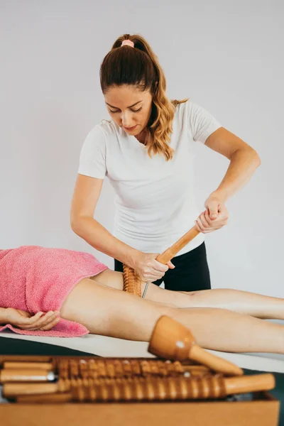 Middle age woman at anti cellulite massage treatment. Close up shot.