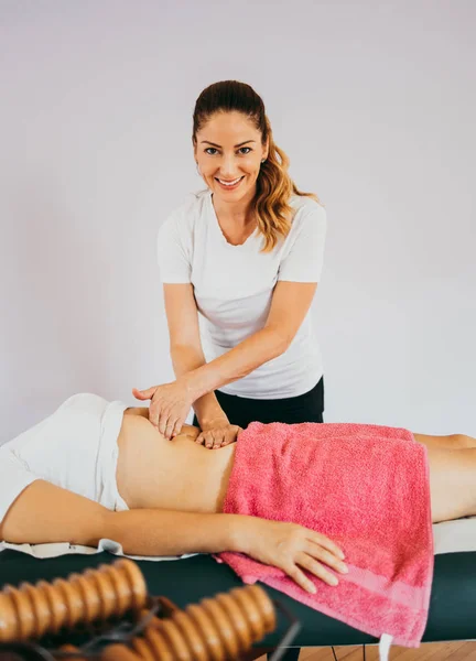 Middle age woman at anti cellulite massage treatment. Close up shot.