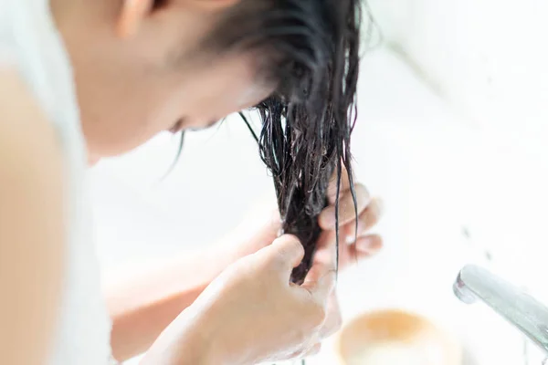 Closeup Woman Applying Hair Conditioner Light Bathroom Selective Focus — Stock Photo, Image