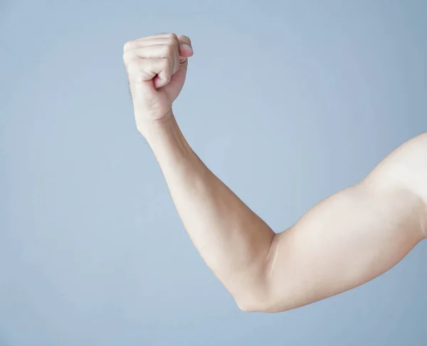 Close up arm muscle man with grey background, health care and medical concept Royalty Free Stock Photos