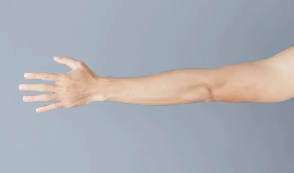 Close up man hand with grey background, health care concept — Stock Photo, Image