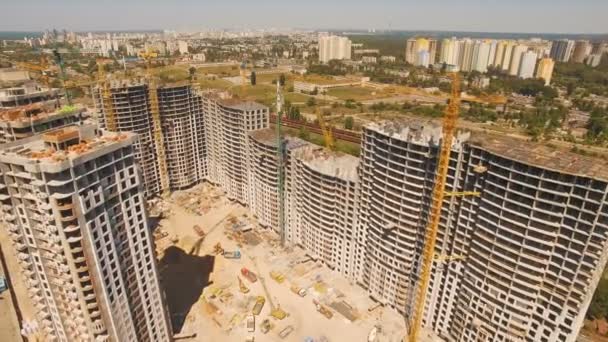 Aerial shoot of construction site with tower cranes. Construction drone footage — Stock Video