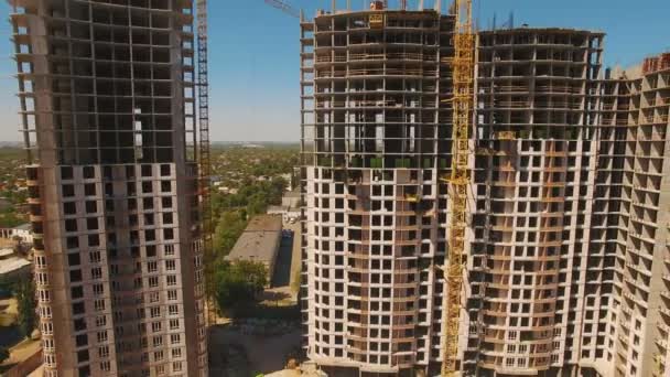 Aerial shoot of construction site with tower cranes. Drone footage — Stock Video