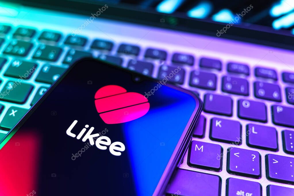 Prague, Czechia - 08 19 2025: A close-up view of a mobile phone lying on a keyboard, displaying Likee logo. Likee is a platform for creating and sharing short videos.