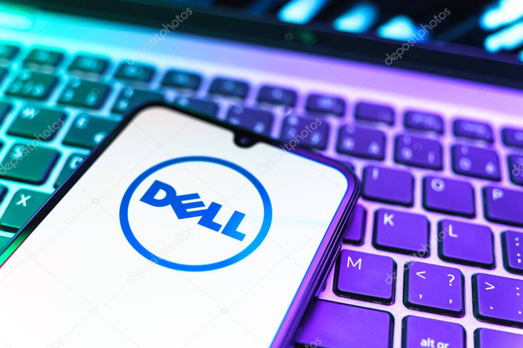 Prague, Czechia - 08 19 2025: A close-up view of a mobile phone lying on a keyboard, displaying Dell logo. Dell is a technology company producing computers and IT solutions.