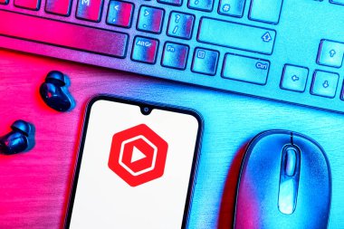 Prague, Czechia - 08 09 2025: A top-down view of a desk with a phone displaying the Youtube Studio logo. Youtube Studio is a platform for managing and analyzing YouTube channels.