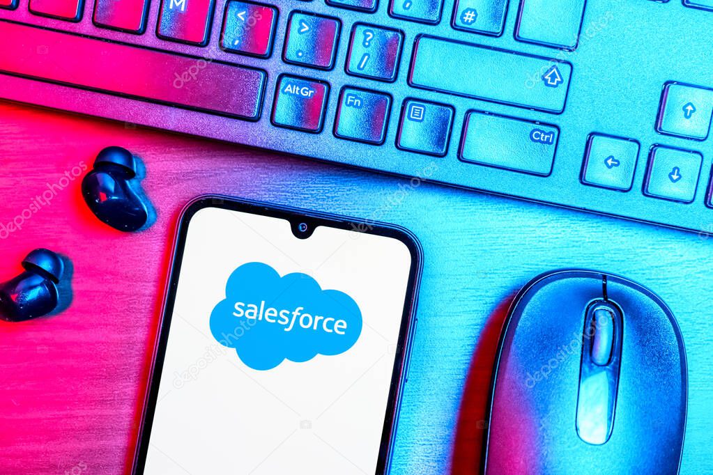 Prague, Czechia - 08 09 2025: A top-down view of a desk with a phone displaying the Salesforce logo. Salesforce is a platform for customer relationship management and cloud services.
