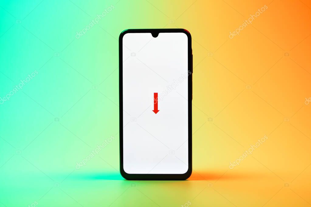 Prague, Czechia - 08 10 2025: A mobile phone standing on a uniform background displays the FedEX logo. FedEX is a logistics company providing shipping and courier services.