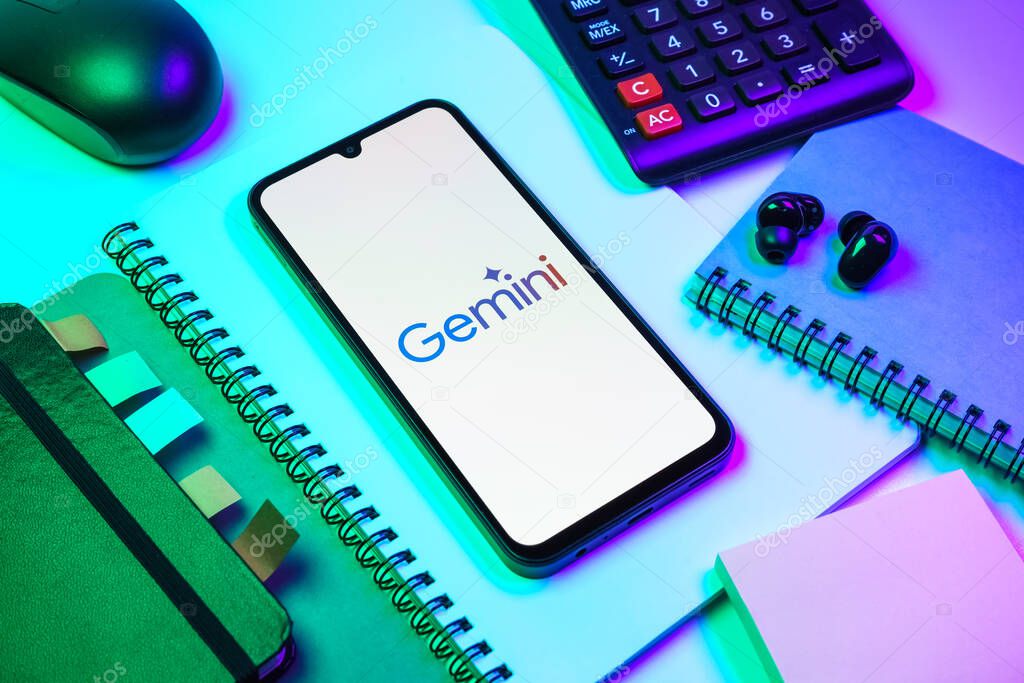 Prague, Czechia - 08 18 2025: An arrangement of office supplies with a mobile phone in the center displaying Gemini logo. Gemini is a platform for cryptocurrency trading and management.