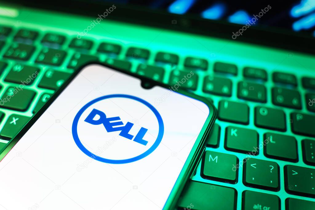 Prague, Czechia - 08 19 2025: A close-up view of a mobile phone lying on a keyboard, displaying Dell logo. Dell is a technology company producing computers and IT solutions.