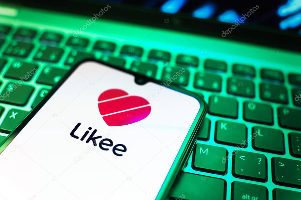 Prague, Czechia - 08 19 2025: A close-up view of a mobile phone lying on a keyboard, displaying Likee logo. Likee is a platform for creating and sharing short videos.