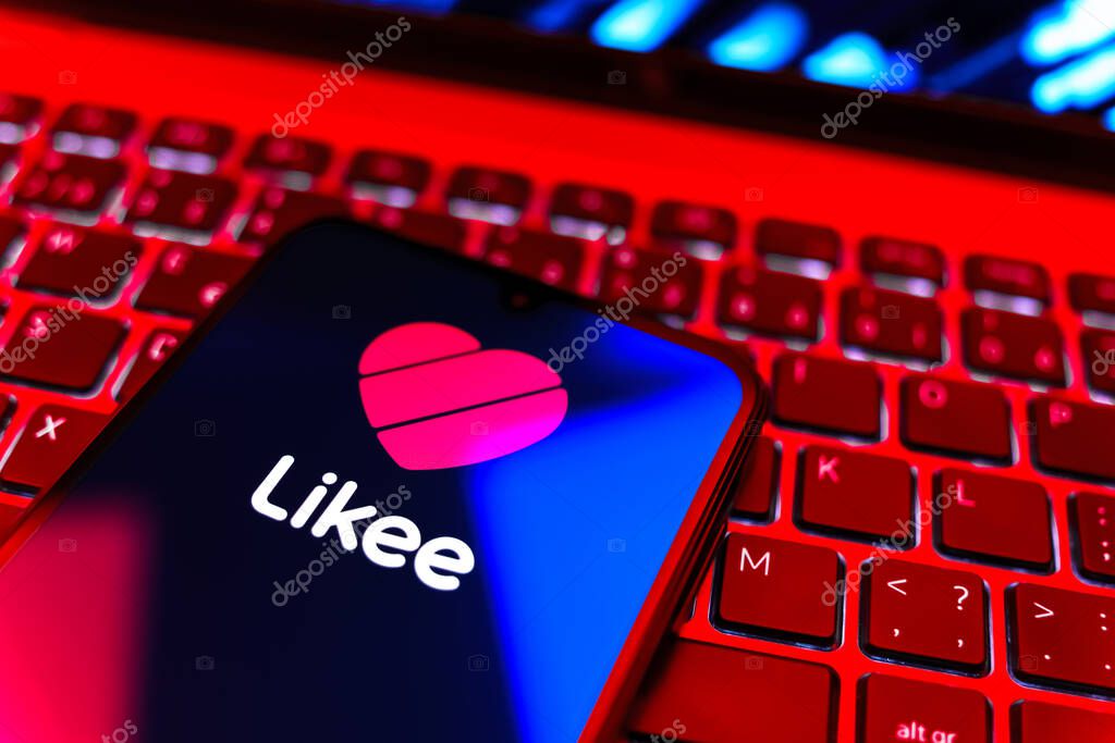 Prague, Czechia - 08 19 2025: A close-up view of a mobile phone lying on a keyboard, displaying Likee logo. Likee is a platform for creating and sharing short videos.