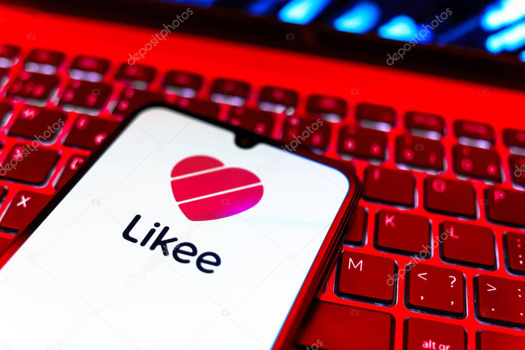 Prague, Czechia - 08 19 2025: A close-up view of a mobile phone lying on a keyboard, displaying Likee logo. Likee is a platform for creating and sharing short videos.