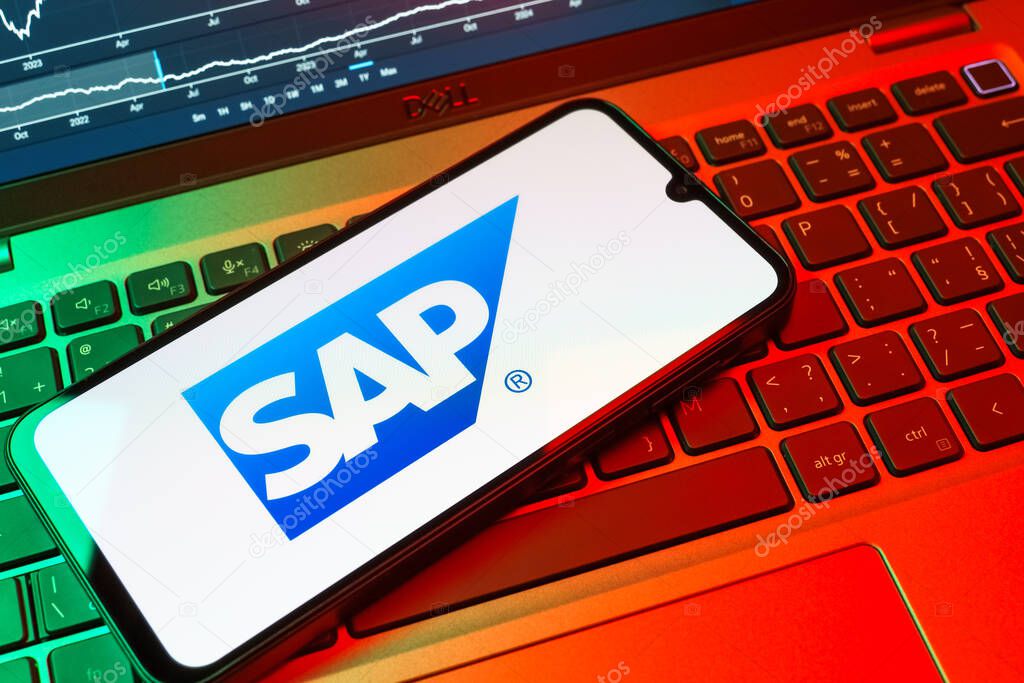 Prague, Czechia - 08 18 2025: A mobile phone on a keyboard displays SAP logo. SAP is a software company providing enterprise applications and solutions.