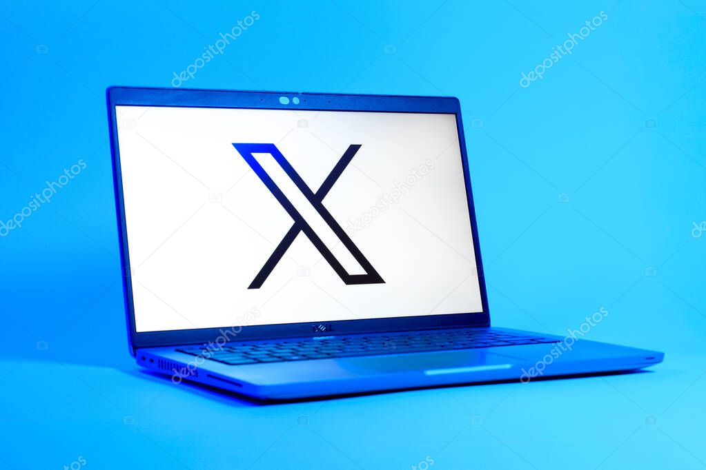 Prague, Czechia - 05 18 2025: A low-angle view of a laptop displaying X logo. X is a platform for sharing short posts and updates.