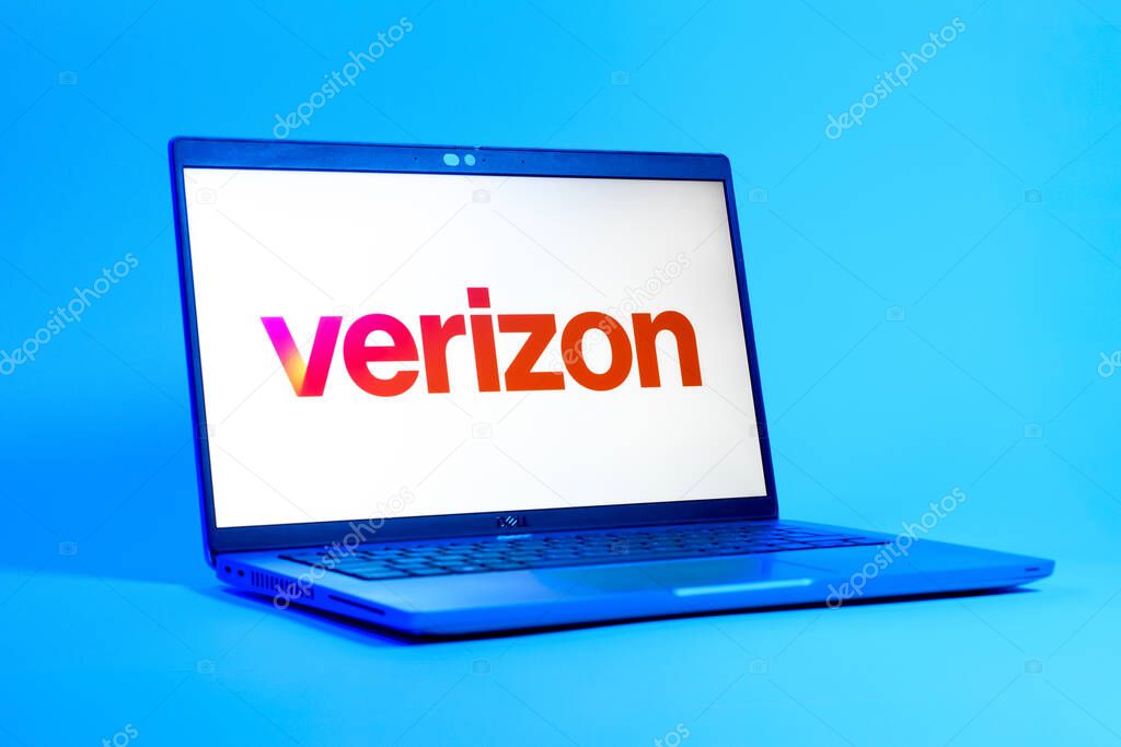 Prague, Czechia - 05 18 2025: A low-angle view of a laptop displaying Verizon logo. Verizon is a telecom company providing wireless and broadband services.