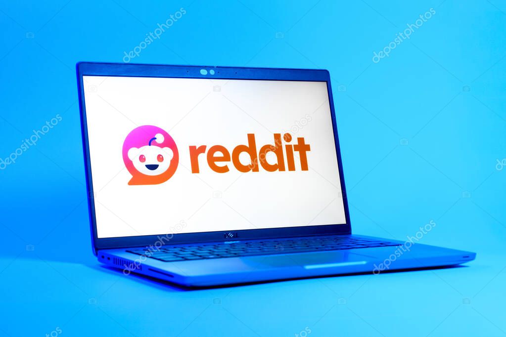 Prague, Czechia - 05 18 2025: A low-angle view of a laptop displaying Reddit logo. Reddit is a platform for discussion, news, and community content.
