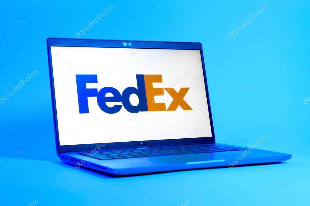 Prague, Czechia - 05 18 2025: A low-angle view of a laptop displaying FedEX logo. FedEX is a logistics company providing shipping and courier services.