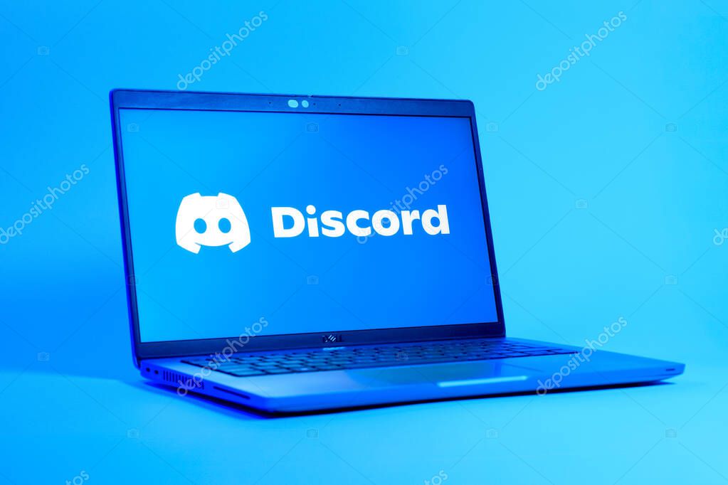 Prague, Czechia - 05 18 2025: A low-angle view of a laptop displaying Discord logo. Discord is a platform for voice, video, and text communication.