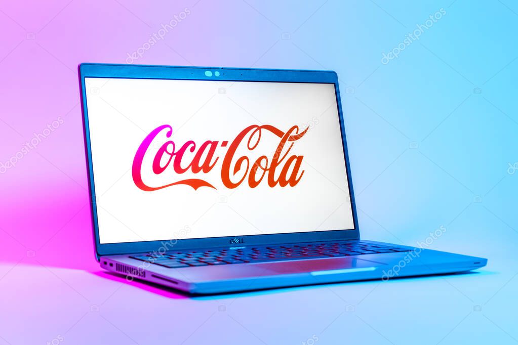 Prague, Czechia - 05 18 2025: A low-angle view of a laptop displaying Coca-Cola logo. Coca-Cola is a beverage company known for its soft drinks.