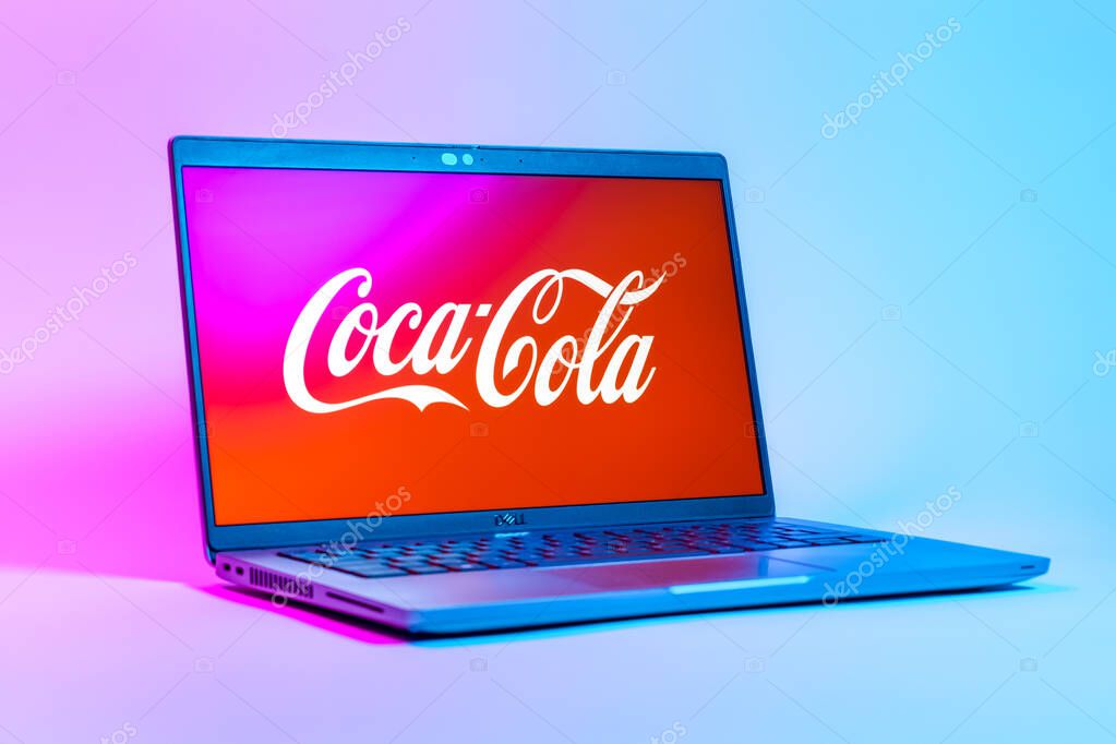 Prague, Czechia - 05 18 2025: A low-angle view of a laptop displaying Coca-Cola logo. Coca-Cola is a beverage company known for its soft drinks.