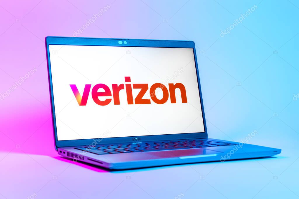 Prague, Czechia - 05 18 2025: A low-angle view of a laptop displaying Verizon logo. Verizon is a telecom company providing wireless and broadband services.