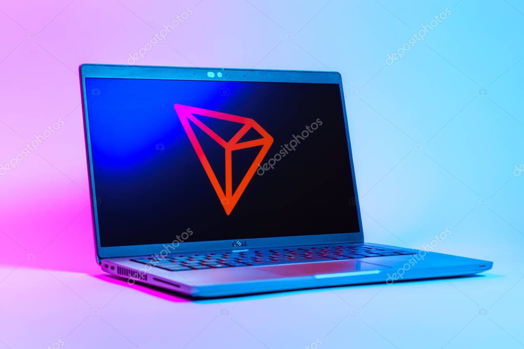 Prague, Czechia - 05 18 2025: A low-angle view of a laptop displaying Tron logo. Tron is a blockchain platform for decentralized applications.