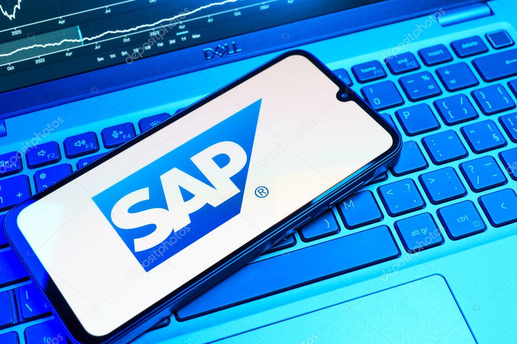 Prague, Czechia - 08 18 2025: A mobile phone on a keyboard displays SAP logo. SAP is a software company providing enterprise applications and solutions.