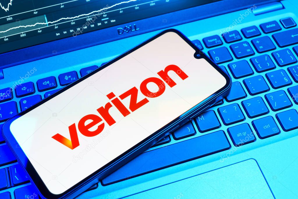 Prague, Czechia - 08 18 2025: A mobile phone on a keyboard displays Verizon logo. Verizon is a telecom company providing wireless and broadband services.