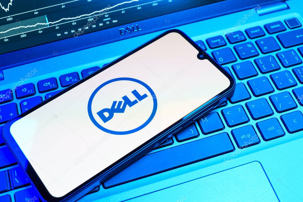 Prague, Czechia - 08 18 2025: A mobile phone on a keyboard displays Dell logo. Dell is a technology company producing computers and IT solutions.