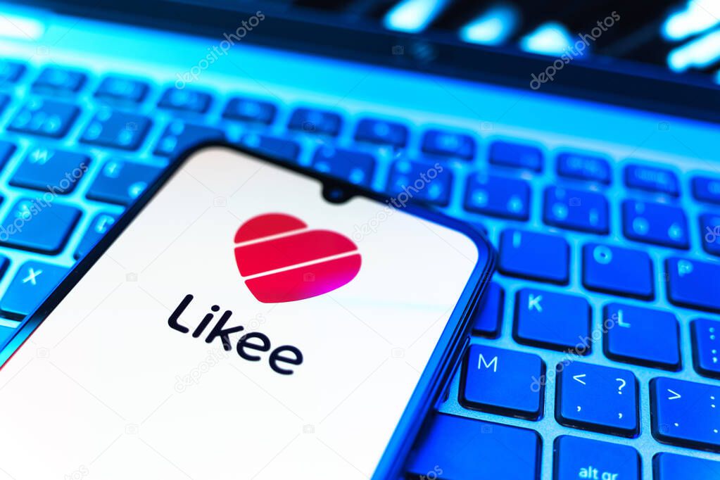 Prague, Czechia - 08 19 2025: A close-up view of a mobile phone lying on a keyboard, displaying Likee logo. Likee is a platform for creating and sharing short videos.