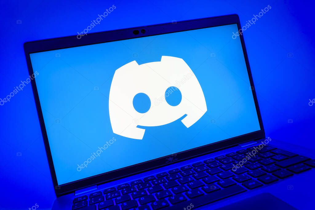 Prague, Czechia - 08 01 2025: A close-up view of a laptop screen displaying the Discord logo. Discord is a platform for voice, video, and text communication.