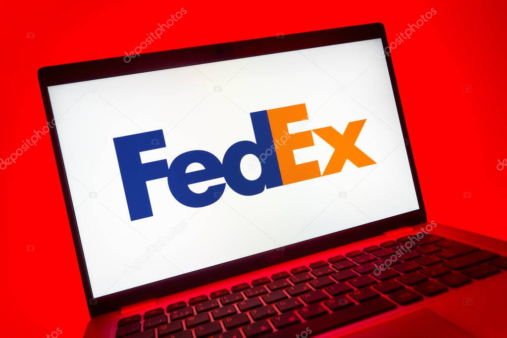 Prague, Czechia - 08 01 2025: A close-up view of a laptop screen displaying the FedEX logo. FedEX is a logistics company providing shipping and courier services.