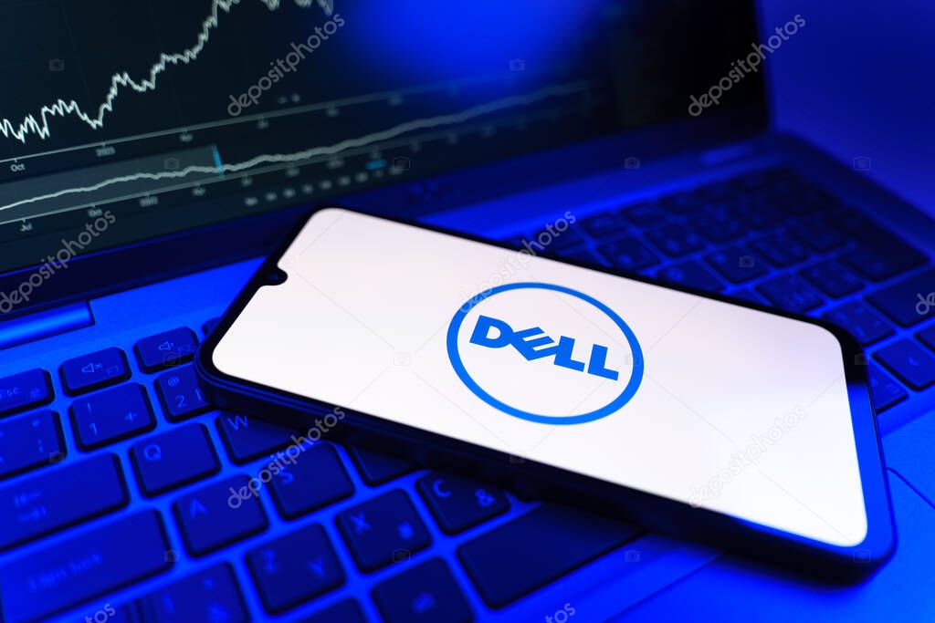 Prague, Czechia - 09 02 2025: Phone on laptop with stock chart showing Dell logo. Dell is a technology company producing computers and IT solutions.