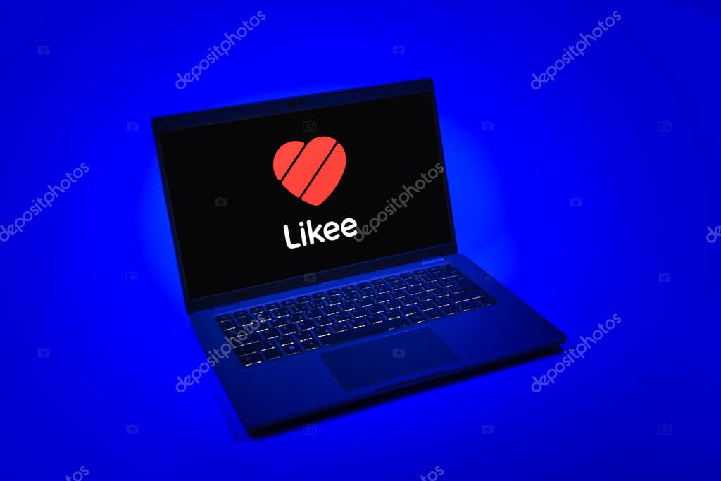 Prague, Czechia - 08 12 2025: A top-down view of a laptop on a uniform background displaying the Likee logo. Likee is a platform for creating and sharing short videos.